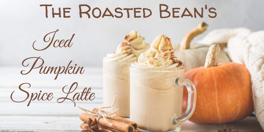 Iced Pumpkin Spiced Latte From The Roasted Bean Iced Pumpkin Spice Latte From The Roasted Bean Coffee Shop. Two glasses of ice cold PSL with pumpkins and cinnamon in the background.